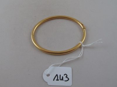 an image of a gold ring with a price tag attached to it