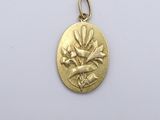 an image of a gold medal with a flower on it
