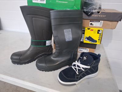 two pairs of boots on a table next to a box