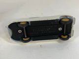 a close up of a skateboard sitting on top of a white surface