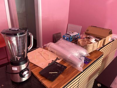 a blender sitting on top of a counter next to a box of food
