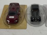 three toy cars that are sitting on top of each other
