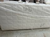 a mattress that is sitting on the floor in a store