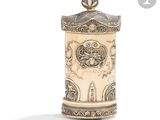 an image of a white and gold vase with a lid