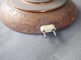 a small metal object that is sitting on top of a table