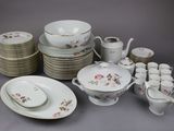 a lot of plates and cups and saucers on the table