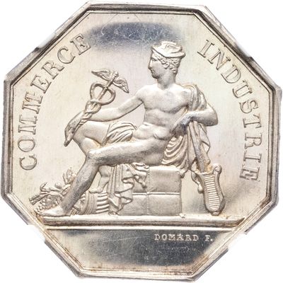 une image représentant une pièce d'argent sur laquelle figurent la statue d'une femme et un oiseau