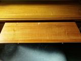 two wooden desks that are sitting next to each other