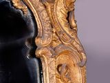 a mirror that is sitting on the wall in the room
