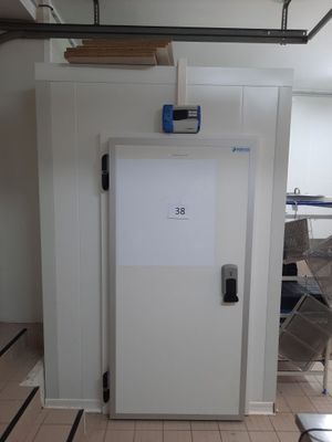 a white door with a sign on it in a room