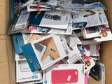 a cardboard box full of electronic devices and other items