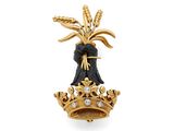 une image représentant une broche en or et diamants ornée d'une couronne