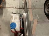 a small machine that is sitting in a garage