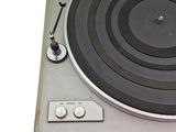 a turntable with a record player on top of it