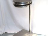 an image of a metal table with a lid on it