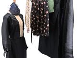 a dress and jacket on a mannequin on a stand