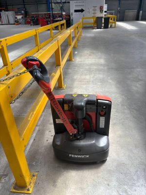 a machine that is sitting on the floor in a warehouse