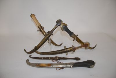 several different types of knives are displayed on a white surface