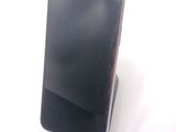 a cell phone that is sitting on top of a stand