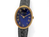 a close up of a wrist watch with roman numerals on it