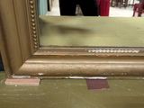 a reflection of a person in a mirror on a table