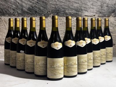 bottles of wine lined up in a row on a table