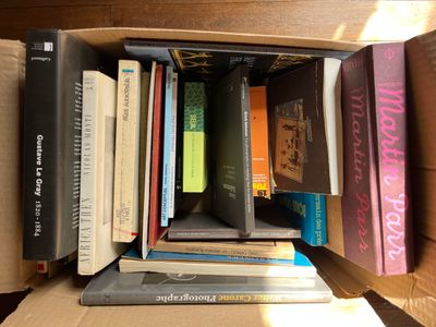 a box full of books sitting on a table