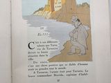 an open book with a picture of a man kneeling on a beach