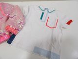 a white shirt and a pink shirt with sequins on it