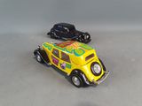 two toy cars that are sitting next to each other