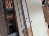 many pieces of wood stacked on top of each other in a garage