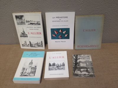 four books are sitting on a table next to each other