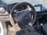 dashboard of a small car with a steering wheel and dashboard controls