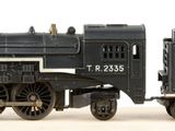 a toy train that is sitting on a white surface