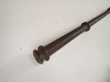 an old baseball bat on a white surface with a white background