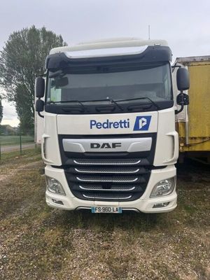 a picture of a white truck parked in a field