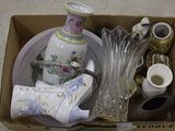 a box full of vases and other items that are in it