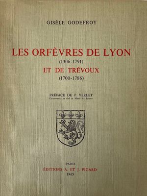 an old book with a picture of a lion on it