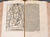 an open book with a drawing of a man on it