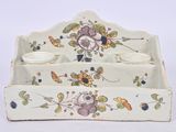 a white tray with a flower design on it