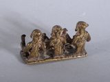 a figurine of a group of people sitting on a bench