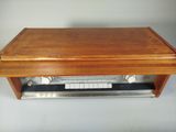 a wooden box that has a keyboard on top of it