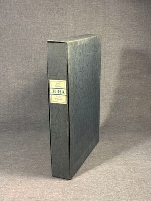 a black book with a yellow label on it