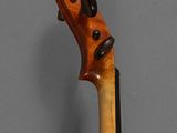 an old violin with a wooden back and a long neck