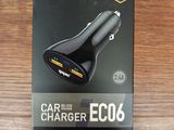 an image of a black car charger on top of a wooden table