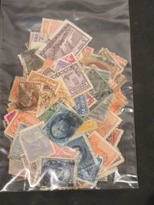 many different stamps in a bag on the table