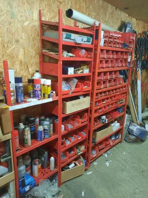 a room with a lot of shelves and bins of items