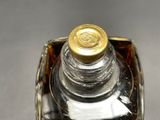a close up of a bottle of perfume on a table
