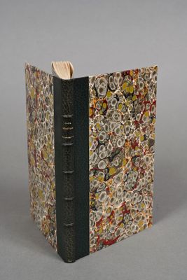 a book with a bookmark on it sitting on a table