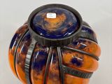a vase with a blue and orange design on it